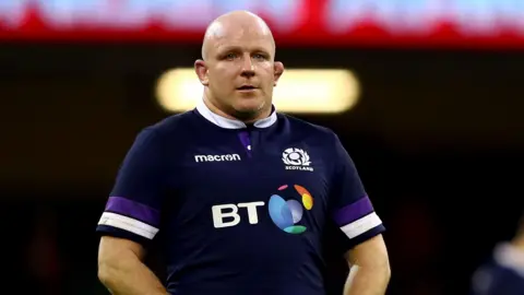 Scott Lawson on the pitch at the end of a Six Nations match for Scotland in 2018