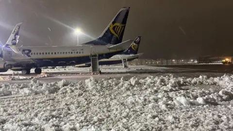 East Midlands Airport Snowy scenes on an airport with Ryanair planes grounded