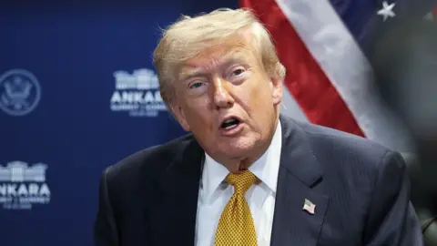 Donald Trump is talking to the press.