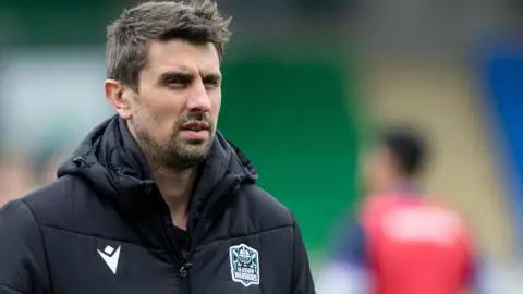 Peter Murchie watches a Glasgow warm-up