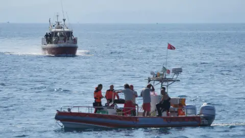 PA Rescue boats on the water on the fifth day of the search and recovery operation after the luxury yacht Bayesian sank in a storm on Monday