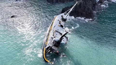 A shipwreck is seen from a bird's eye view.