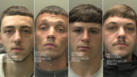 South Wales Police A composite image of custody photos for four men, all looking straight at the camera. They all have short brown hair and short stubble. 