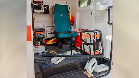 Provided by a third party Inside an ambulance, vital equipment is strewn on the floor following a drone attack while out attending to a patient 