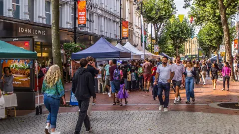 Getty Images A picture from 2023 of people walking through Reading town centre.