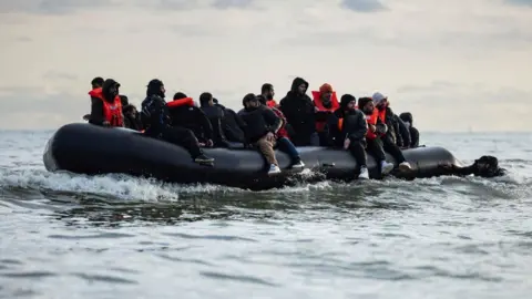 Getty Migrants cross the channel