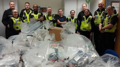 Lincolnshire Police Police officers and bags of vapes