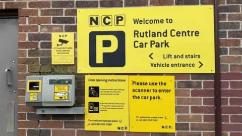 picture of signage including a security camera warning