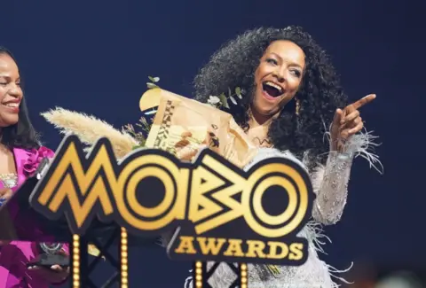 Mobo founder Kenya King (right) on stage during the Mobo Awards, at the Utilita Arena Newcastle.