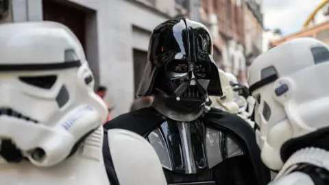 Picture of star wars villain Darth Vader with white Stormtroopers 