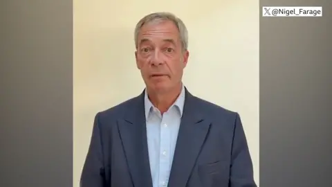 Nigel Farage wearing a suit and shirt