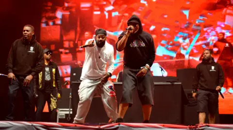 Five members of Wu-Tang Clan performing on stage at Glastonbury in 2019