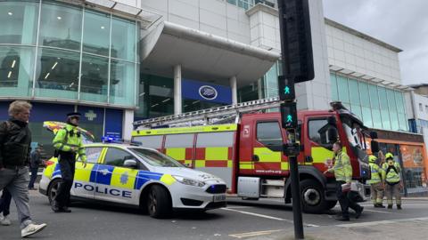A police car and fire engine outside Boots in North Street, Brighton