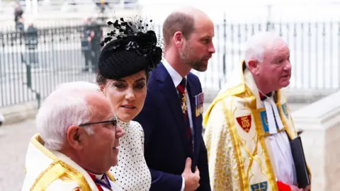 Princess Catherine and Prince William walking together into Westminster Abbey
