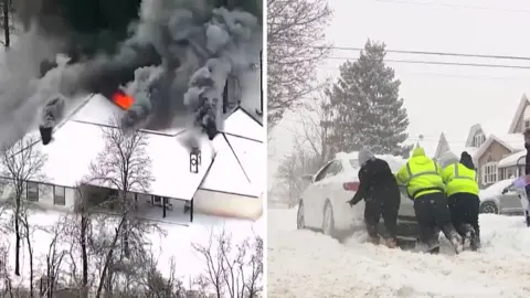 On the left, a house is on fire. On the right, we see three people pushing a vehicle.