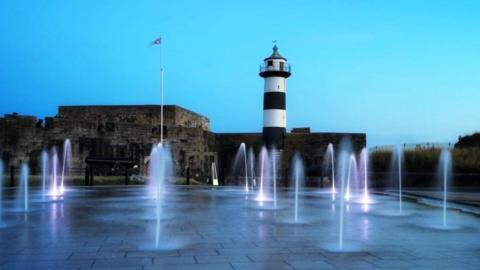 Southsea Castle with vertical water jets lit up in front