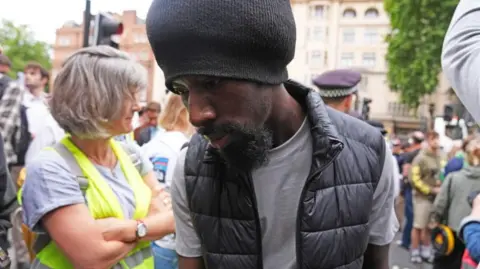 Charles Brohiri arrives at Westminster Magistrates' Court, London.