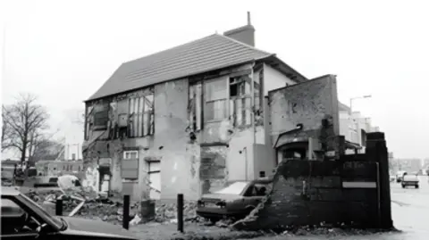 Melton Borough Council A black and white photo showing the building in a derelict state