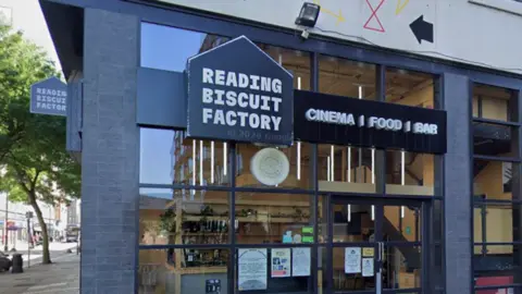 A Google Maps picture of the entrance to Reading Biscuit Factory, with a sign that says "Cinema | food | bar".