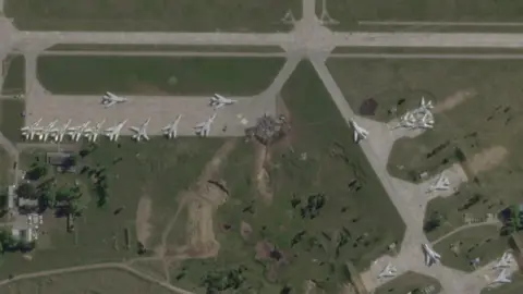 PLANET LABS/REUTERS A satellite view shows military aircraft, some sitting destroyed, at the Belaya air base, near Stepnoy, Irkutsk region, Russia, June 4, 2025