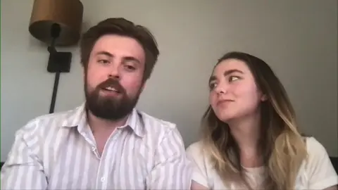 Halvor, who has brown hair and a beard, sat next to his girlfriend Iselin, who has brown shoulder length hair with highlights, as he speaks to the BBC on a video call