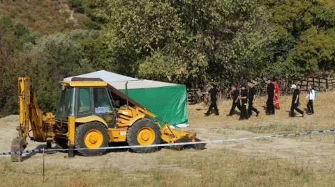 Gareth Fuller/PA Forensic officers working on the land where Ben disappeared in 1991