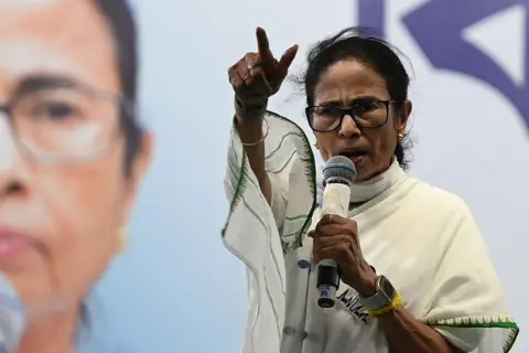 Hindustan Times via Getty Images Chief Minister and All India Trinamool Congress (AITC) chairperson Mamata Banerjee address people in an election campaign rally in support of party's candidates for State Assembly Election at Beleghata on April 20, 2026 in Kolkata, India. (Photo by Samir Jana/Hindustan Times via Getty Images)