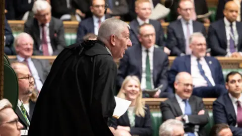 House of Commons Sir Lindsay Hoyle leans forward to tell off an MP in the Commons chamber