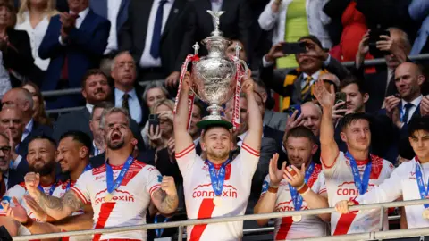 Hull Kingston Rovers' Mikey Lewis lifts the trophy during the Challenge Cup Final at Wembley Stadium, London.