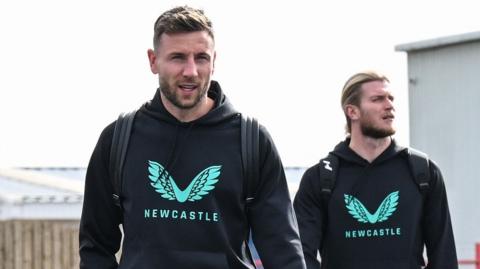 Paul Dummett and Loris Karius in Newcastle United branded hooded tops