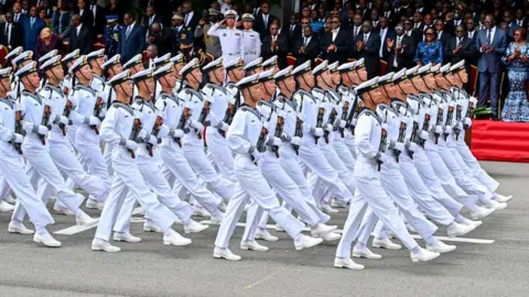  Sia Kambou / AFP An image of China's armed forces parading during celebrations for the 64th anniversary of Ivory Coast's independence in the resort town Grand-Bassam, Ivory Coast - Wednesday 7 August 2024