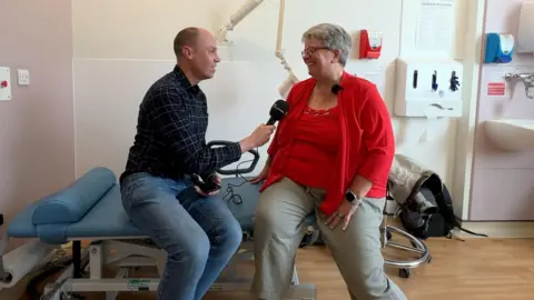 Dan Freeman talking to cancer nurse specialist Jackie Redgwell.