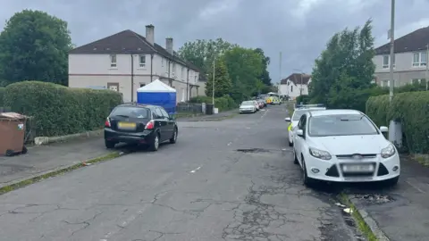 Police cars on Brock Road in Pollok