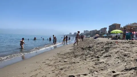 Guy Hedgecoe Bathers and sunbathers on the beach in Málaga