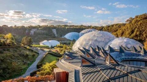 A view of the biodomes at the Eden Project in St Austell, Cornwall. It is a sunny day.