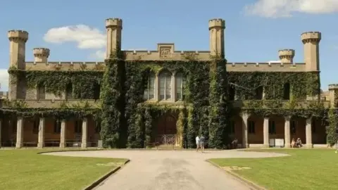 The outside of Lincoln Crown Court, covered in greenery 