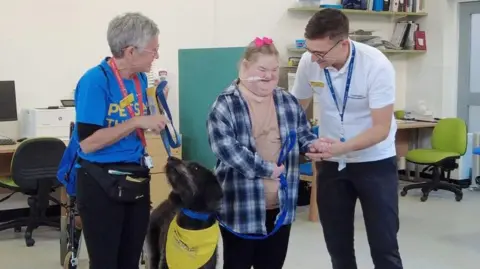 Cambridge University Hospitals Lisa Smart, PAT dog Poppy, Evie and Jonny Littlewood