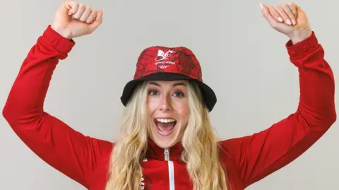 Emma Finucane wearing a bucket hat at Wales' kitting out day