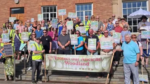 Friends of Chaddesden Wood Dozens of people with signs and banners standing outside of Derby City Council House
