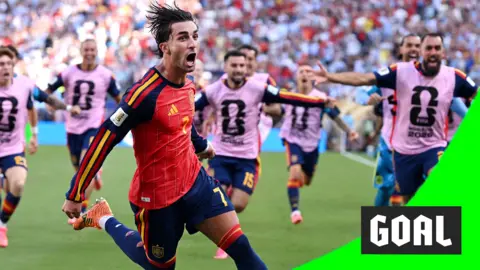 Ferran Torres runs and shouts to celebrate scoring for Spain in the World Cup final.