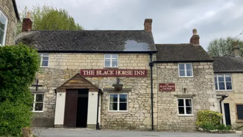 BBC Entrance to the Black Horse Inn in Cranham
