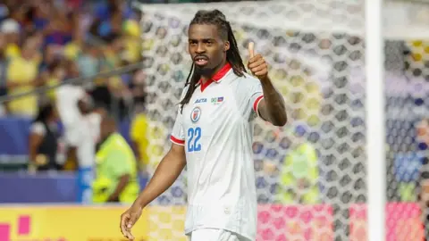 Jean-Kevin Duverne puts his thumb up
