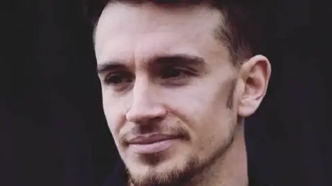 West Midlands Police A man with a brown beard and moustache 