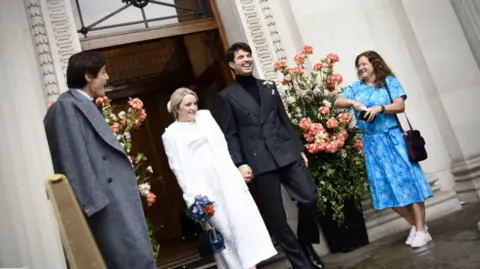 Filippa Evans-Grindrod and Harry Grindrod after getting married at Old Marylebone Town Hall