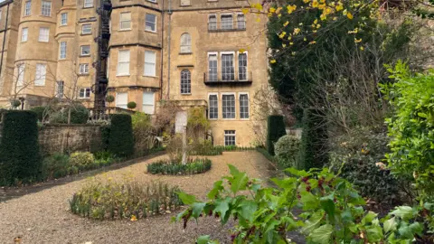 John Wimperis A Georgian-style garden at the back of an historic Bath townhouse, recreated to how it would have looked originally, with the flower beds, paths and trellis  located by excavation in 1985.