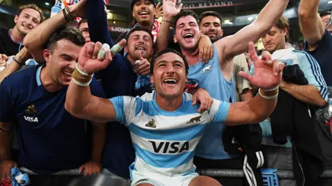 Rodrigo Isgro celebrates with Pumas fans
