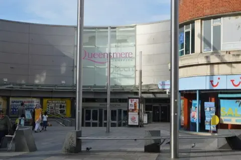 Geograph/N Chadwick The exterior of the Queensmere shopping centre, with its inwardly curving frontage.