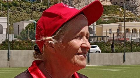 Wicketkeeper Sally Barton with the rock of Gibraltar in the background
