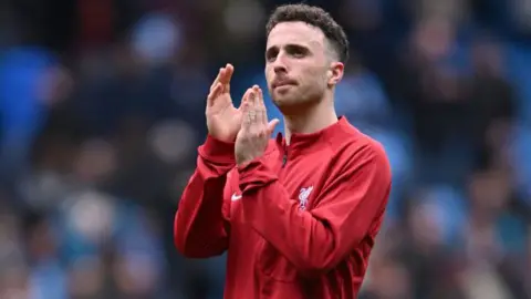 Diogo Jota of Liverpool applauds the crowd after the Premier League match