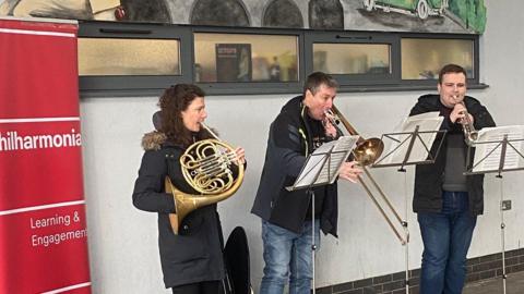 The Philharmonica playing at Bedford bus station 